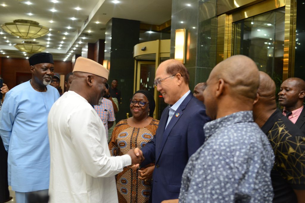Hon. Minister of Transportation Engr. Mu’azu Jaji Sambo, in a warm handshake with Secretary General of the IMO His Excellency Kitack Lim while FMOT Permanent Secretary, Dr. Magdalene Ajani, Managing Director National Inland Waterways, Dr. George Moghalu, and NIMASA DG Dr Bashir Jamoh looks on in admiration